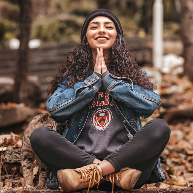 girl smiling in meditation position