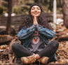 girl smiling in meditation position