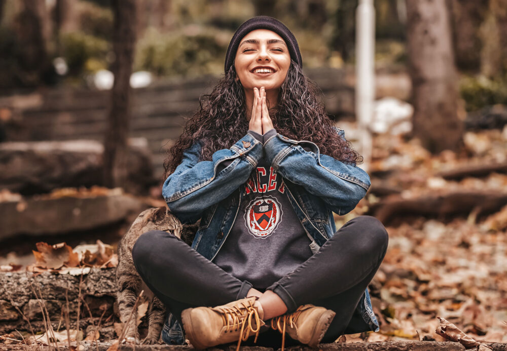 girl smiling in meditation position